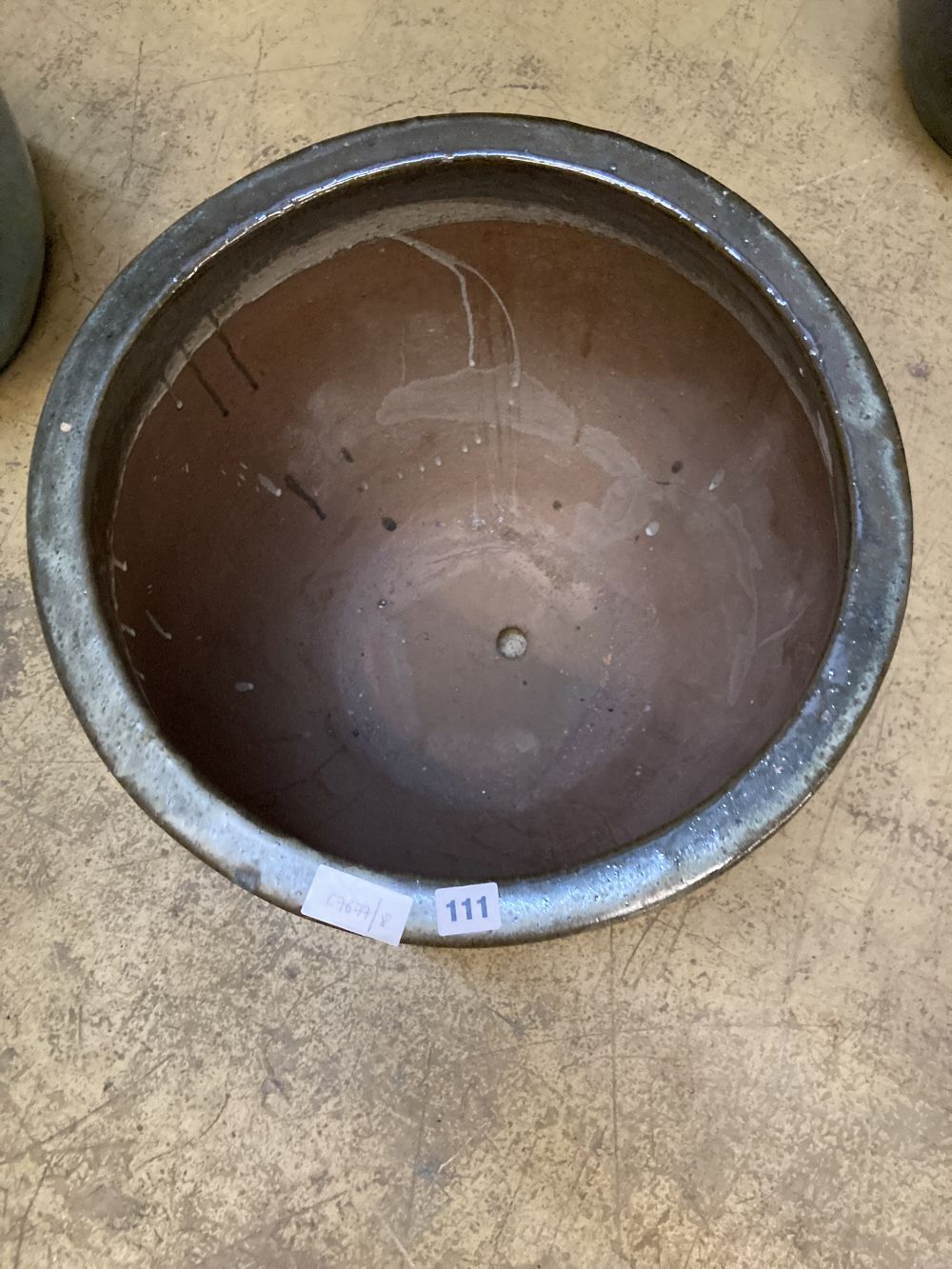 A circular green glazed garden planter, width 48cm, height 39cm